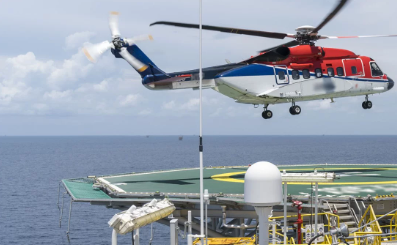 Helicopter approaching an offshore helideck with a helideck camera in view